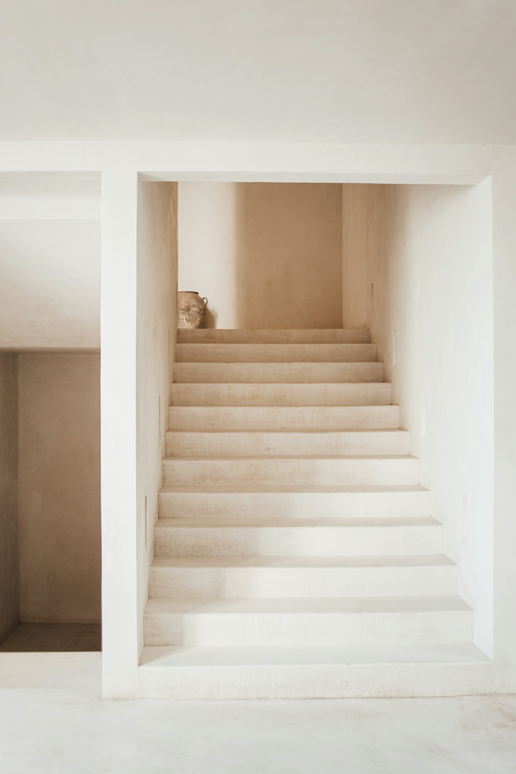 Fitted storage built into the space beneath a staircase